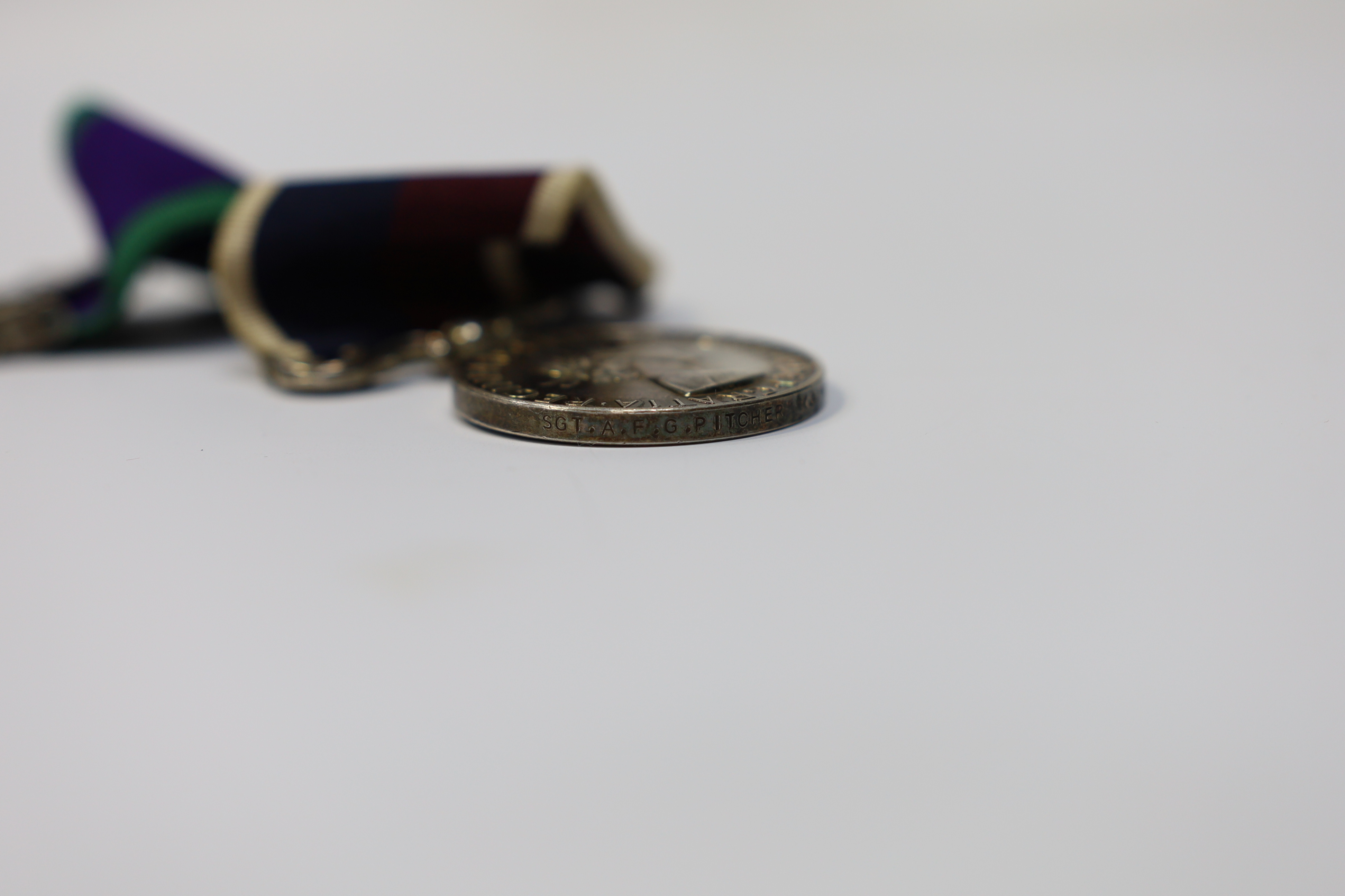 An ERII RAF medal pair awarded to Cpl. A.F.G. Pitcher RAF, comprising; a General Service Medal with a bar for Borneo and an RAF Long Service Medal, mounted on a common pin. Condition - fair to good